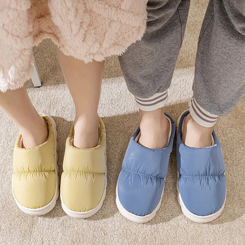 Blue down cotton winter slippers with thick rubber sole and plush lining for indoor use.