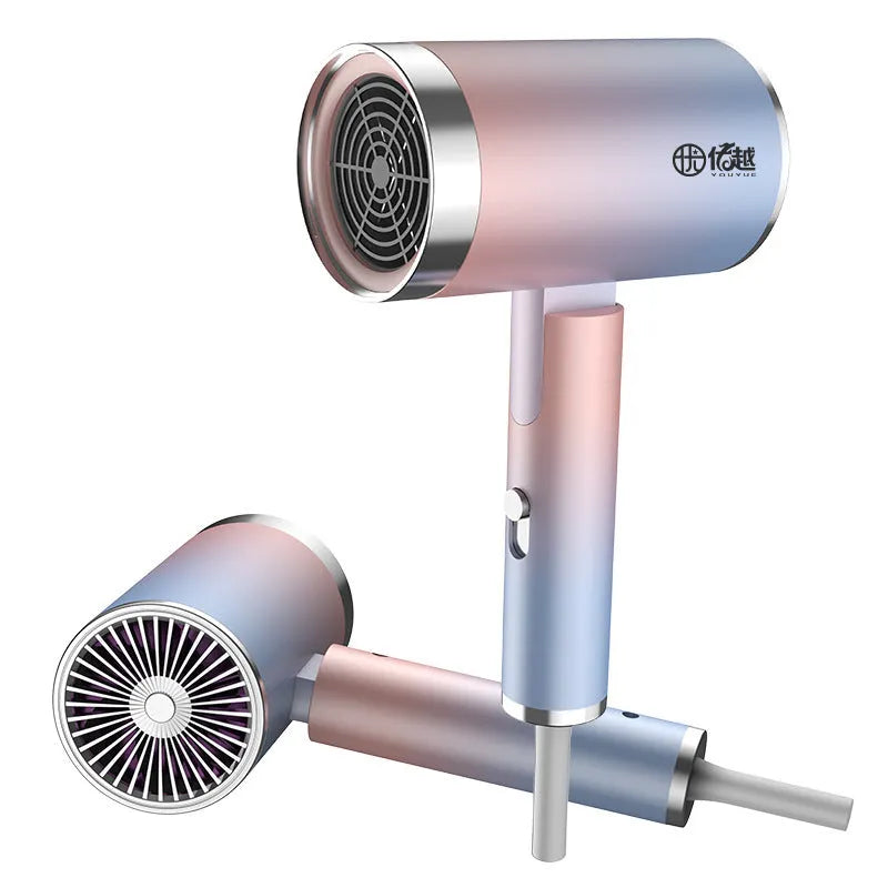 Foldable negative ion hair dryer in emerald green colour with nozzle attached