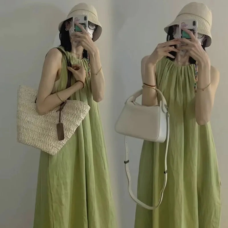 Plus size sleeveless asymmetric cotton blend vest skirt in green with matching black trousers, mid-length street fashion style