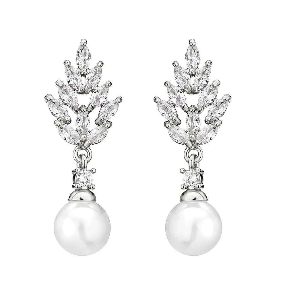 Geometric flower-shaped earrings with micro inlaid zircon and pearl details on a gold-toned metal base.
