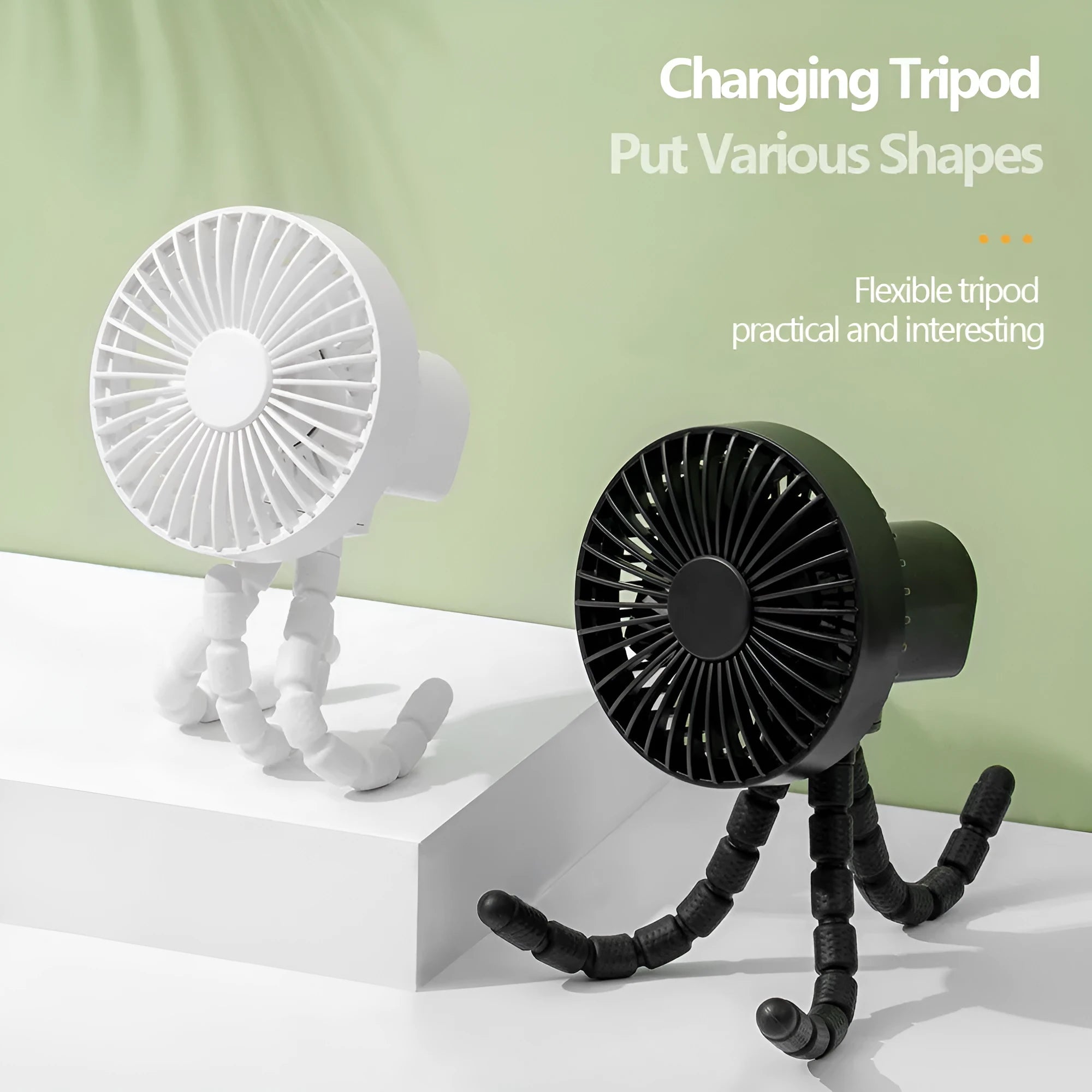 A small black adjustable desktop fan with flexible octopus tripod legs and a bending head on a wooden desk.