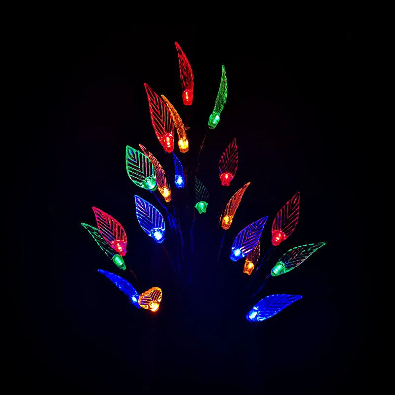 Three solar-powered garden lights with leaf branch design for lawn decoration