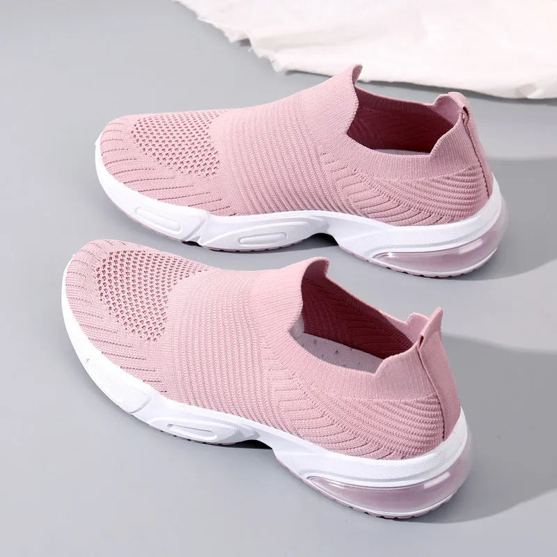 Breathable mesh slip-on lazy sock shoes in black, pink, khaki, and white colours on a PVC sole.