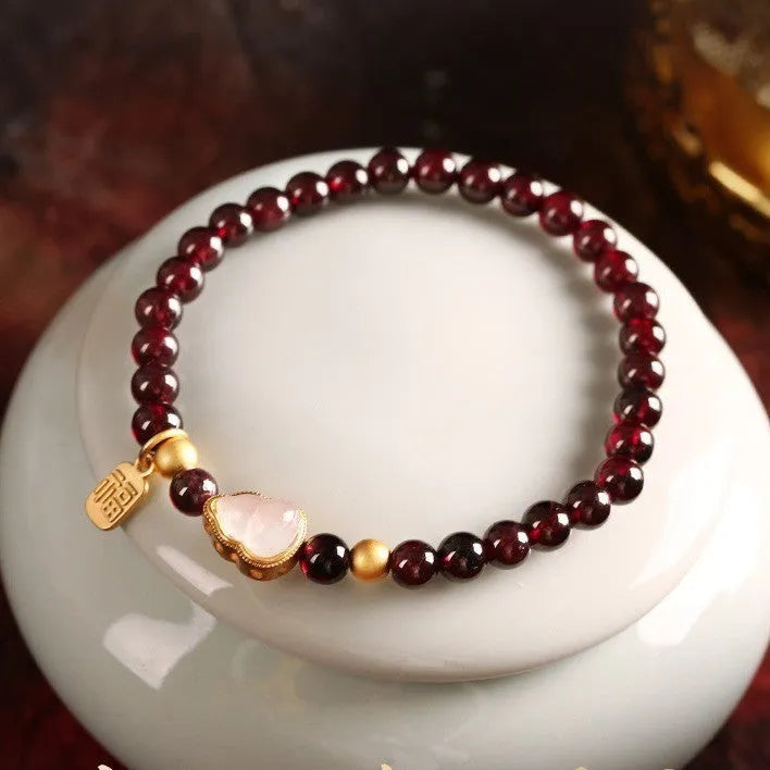 Chinese-style gourd bracelet with imitation garnet beads and Fu character symbols on U-shaped electroplated setting