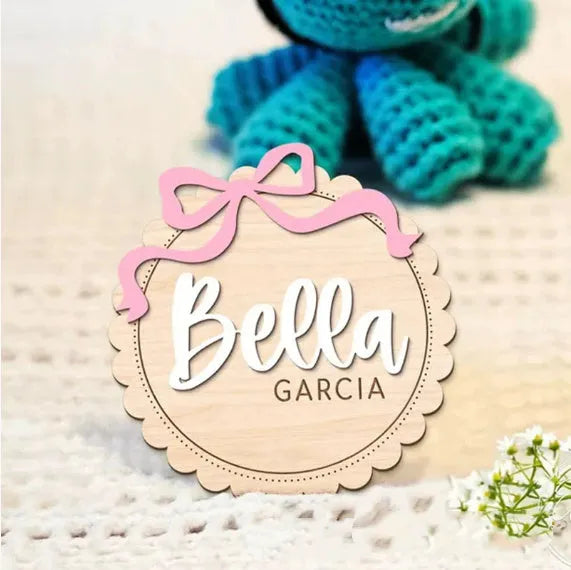 Square wooden baby room ornament with customised name engraving for nursery decor.