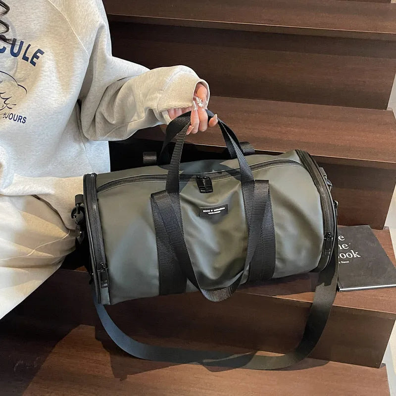 Black waterproof Oxford cloth sports handbag for men and women on a leisure travel background.