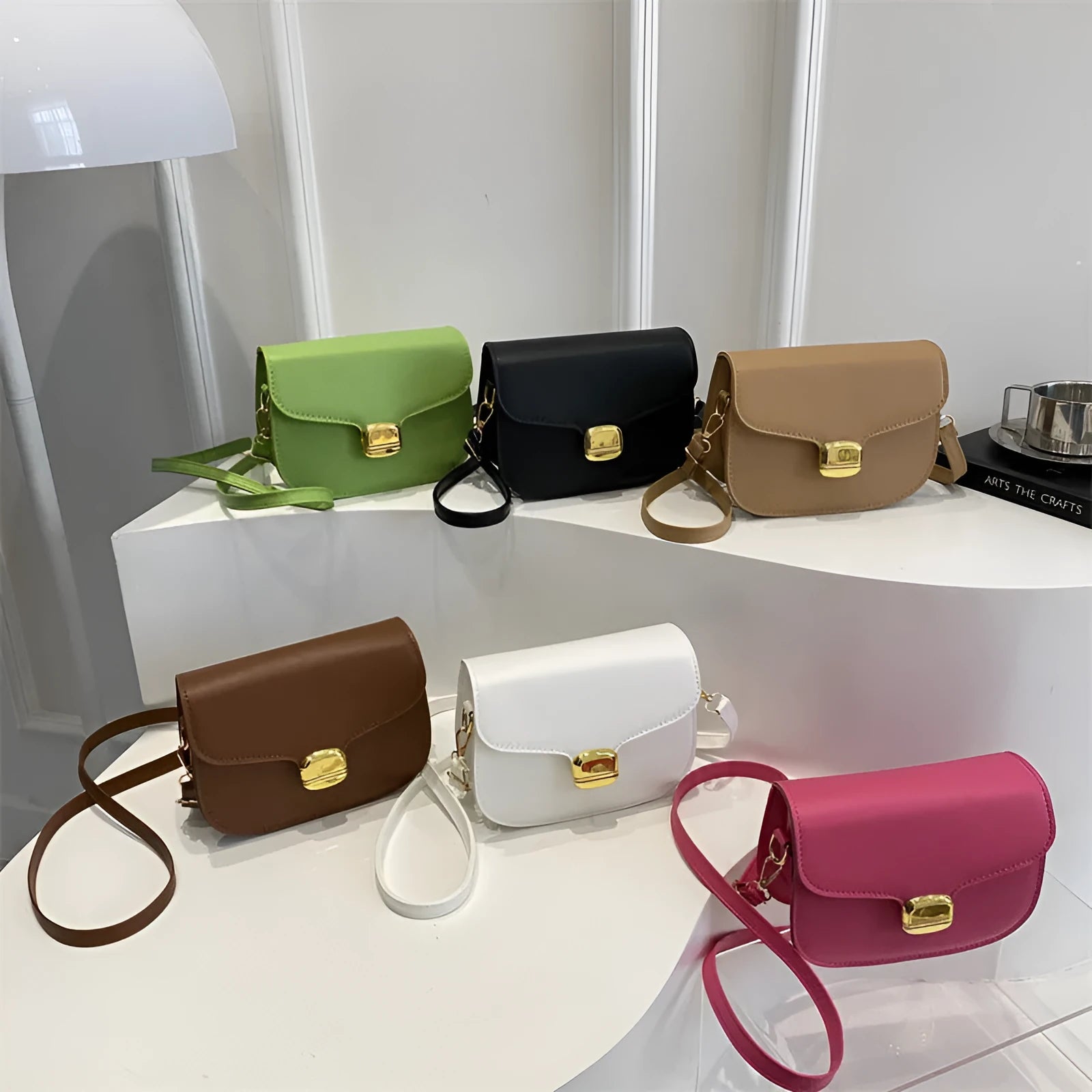Simple PU handbag for women in one of six colours, showing interior with zippered change purse and phone pocket.