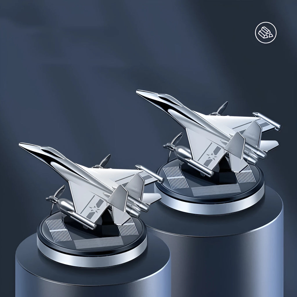 Solar powered rotating aluminium alloy fighter jet shaped car air freshener ornament in silver colour