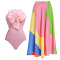 Solid colour women's one-piece swimsuit with deep V halter neck and backless design, shown with matching skirt.