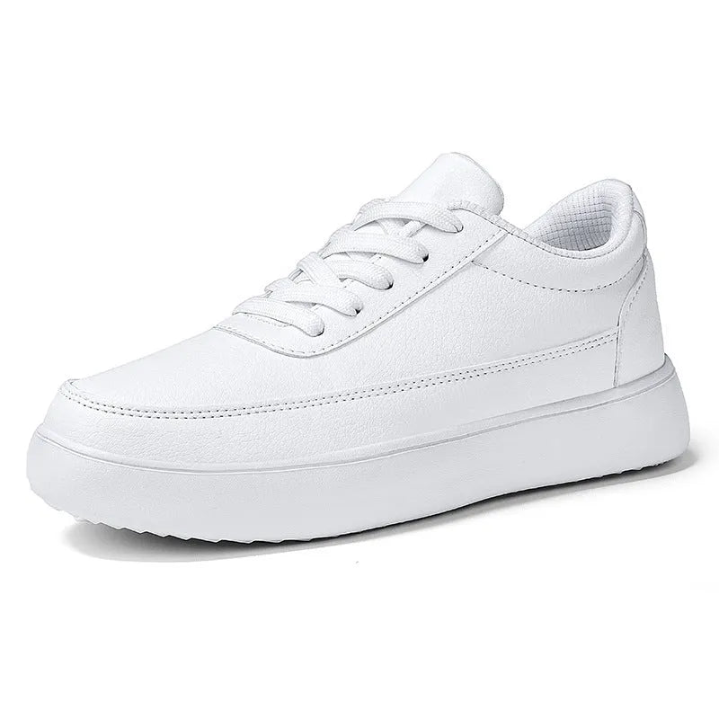 Women's white leather lace-up flat casual shoes on a plain background.