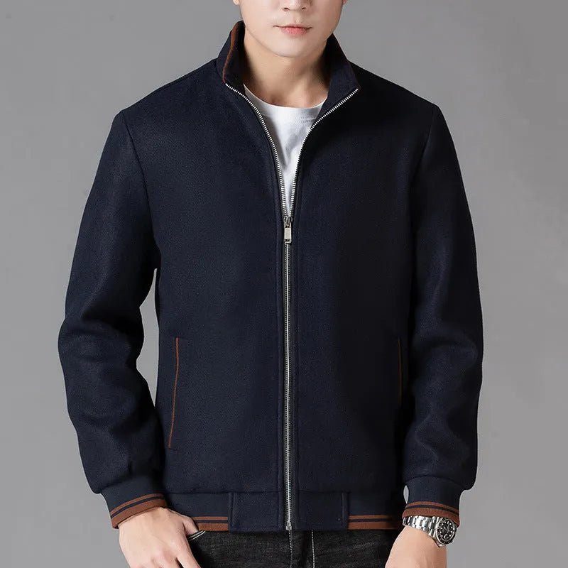 Men's grey polyester fleece sports coat with long sleeves and side pockets.