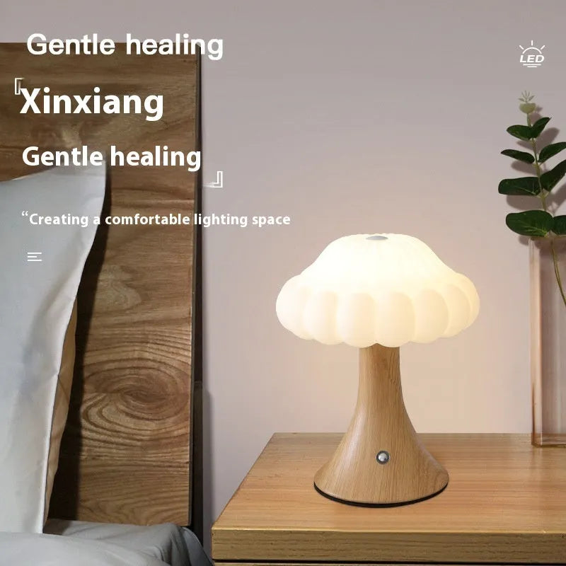 Mushroom-shaped touch control table lamp with USB charging port in wood grain finish.