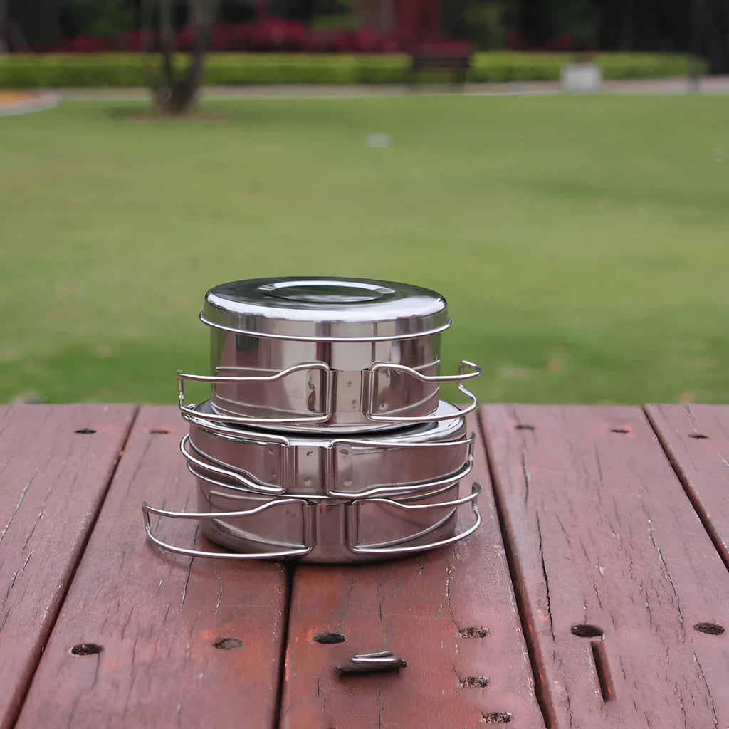 Silver stainless steel camping cookware set with four pieces for outdoor cooking