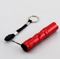 Black aluminium mini LED flashlight showing compact size and textured grip