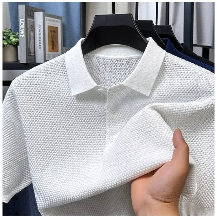 Man wearing a loose grey cotton short sleeve pullover sweater for casual leisure wear.