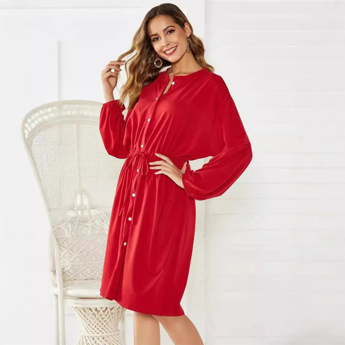 Black mid-length A-line women's dress with elastic cuffs and a cinched waist belt