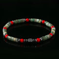 Men's hand-woven bracelet with cylindrical semi-precious stone beads on a string.