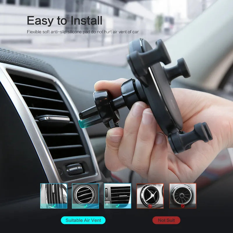 Black gravity car phone holder mounted on a car air vent, showing 360-degree rotation mechanism