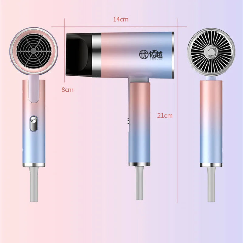 Foldable negative ion hair dryer in emerald green colour with nozzle attached