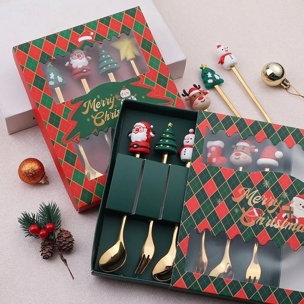 Red stainless steel Christmas spoon and fork set with festive handle designs including trees and snowmen