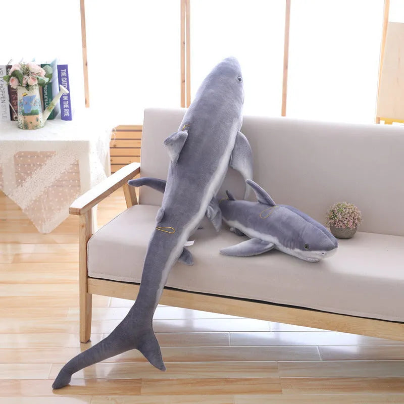 Lifelike soft shark plush toy in shark colour, available in 60cm, 100cm, and 140cm heights, net pocket packaging