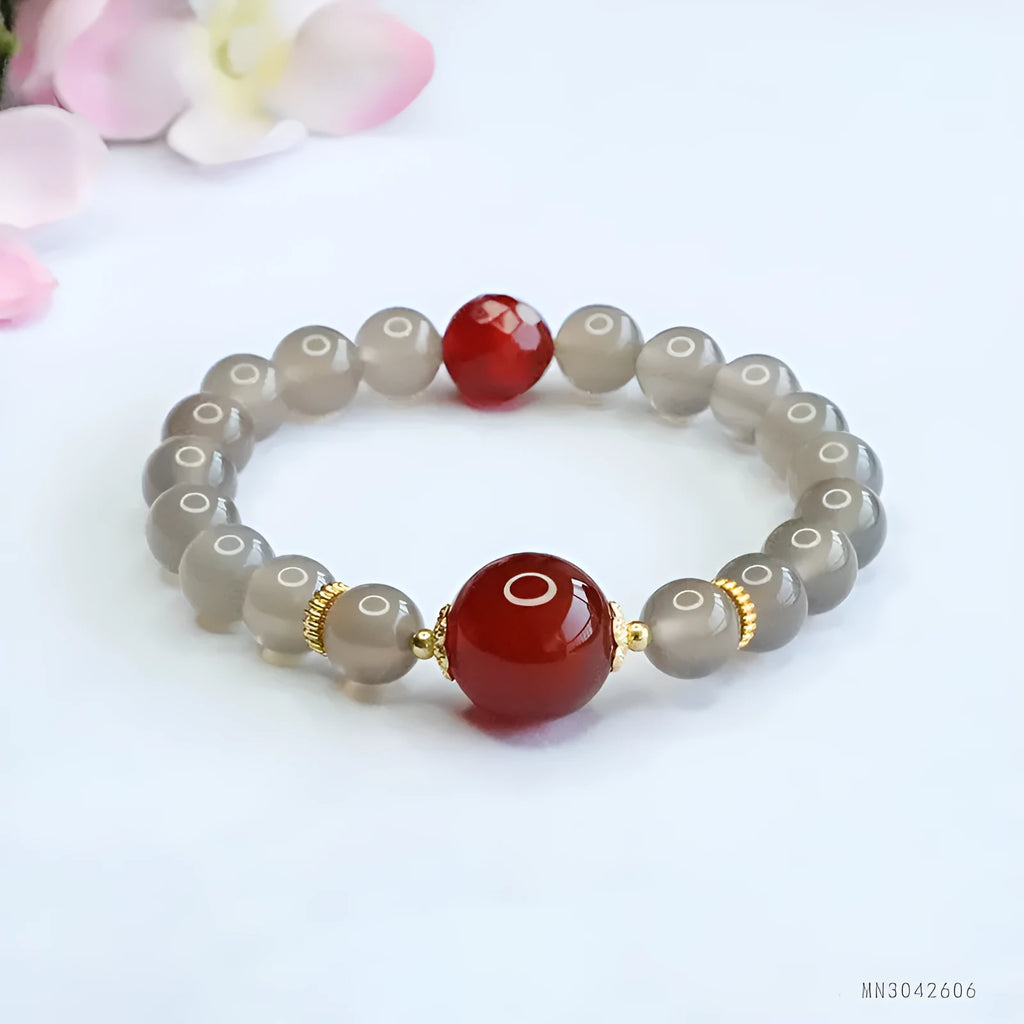 Women's smoky purple agate bracelet with 8mm geometric beads on a white background.
