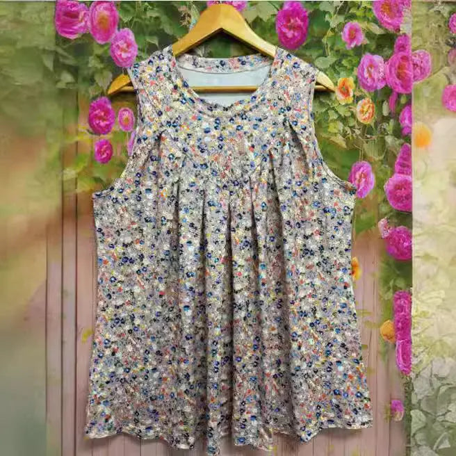 Black plus-size sleeveless vest with floral print detail, shown on a hanger.