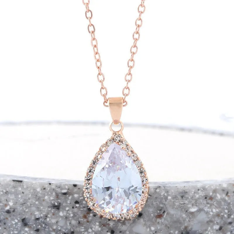 Women's rose gold geometric drop necklace with rhinestone inlay in pink colour