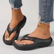 Women's thick-soled EVA flip-flops in black, white, or grey colours with non-slip sole design