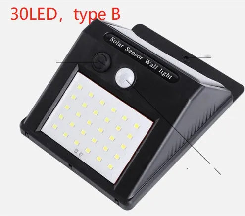 White solar outdoor garden lamp with LED lights and motion sensor for automatic driveway and pathway lighting