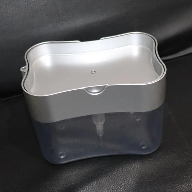 Grey plastic kitchen soap dispenser pump bottle on a countertop