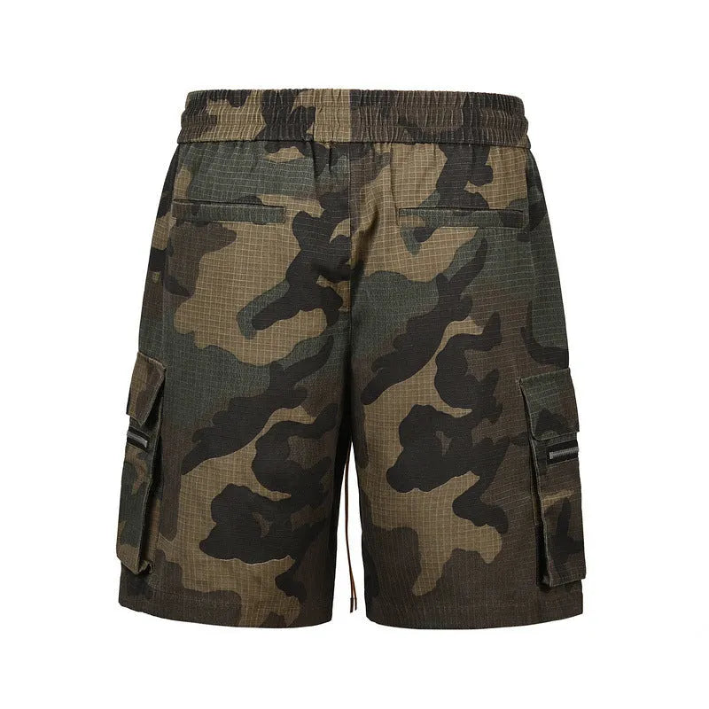 Green washed camouflage cotton cargo shorts with multiple pockets on a mannequin