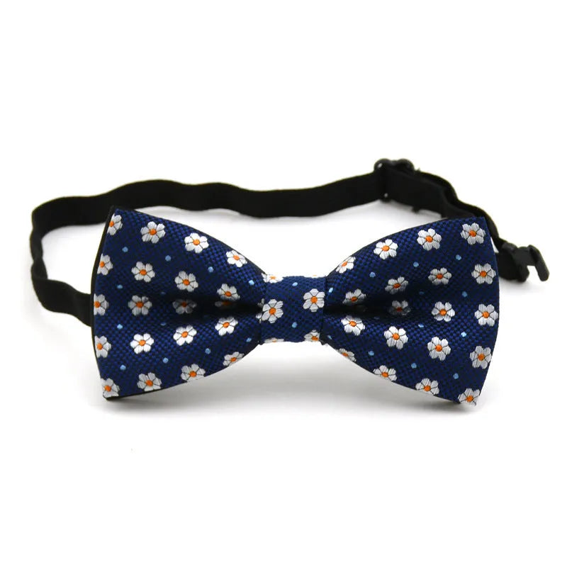Children's polyester bow tie, 10cm by 5cm, with adjustable strap, available in 10 styles.