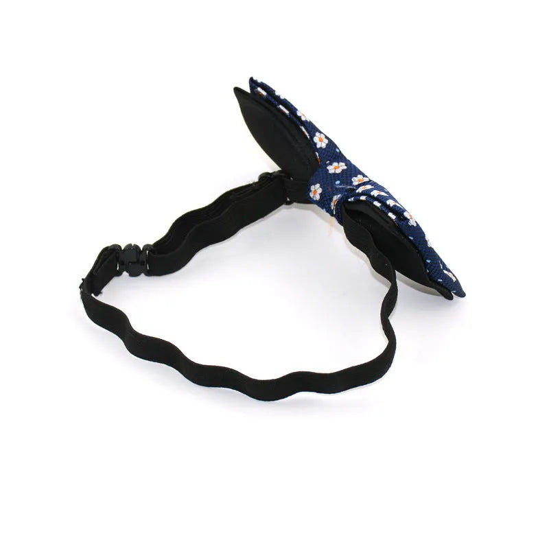 Children's polyester bow tie, 10cm by 5cm, with adjustable strap, available in 10 styles.