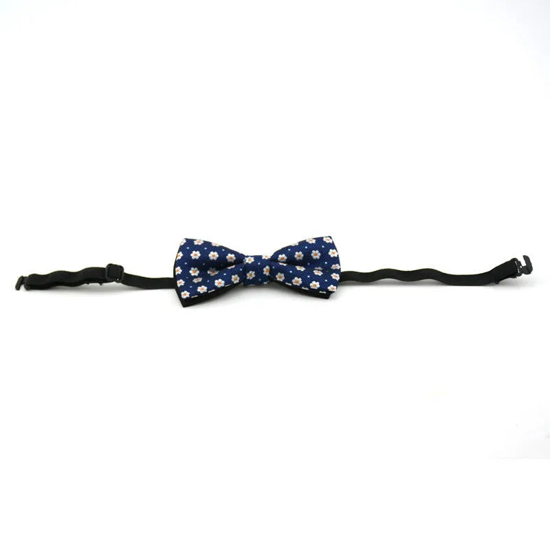 Children's polyester bow tie, 10cm by 5cm, with adjustable strap, available in 10 styles.