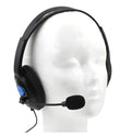 Black PS4 wired gaming headset with large ear cups and an adjustable headband on a white background.