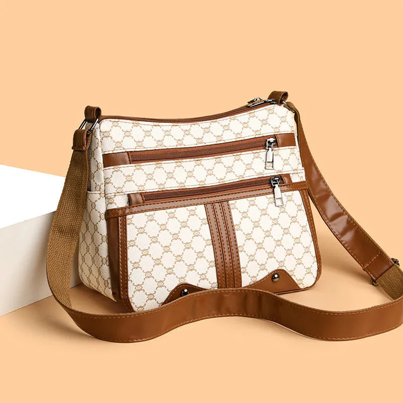 Brown women's crossbody bag with textured stitching pattern and adjustable strap showing interior polyester lining