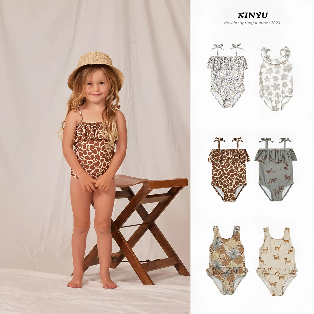 Girls' high elastic one-piece swimsuit in a selection of prints including brown stripes, leopard, and floral patterns.