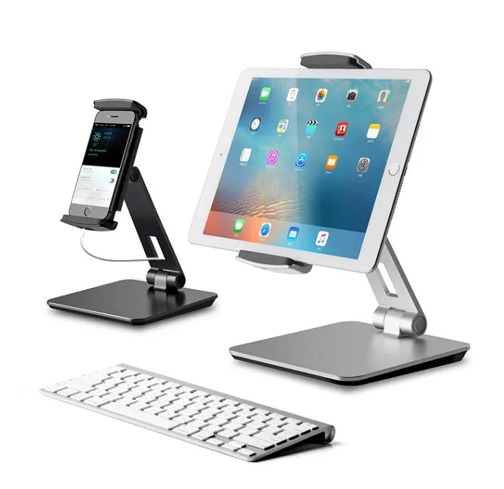 Silver foldable aluminium phone tablet holder on desk showing 360° rotation