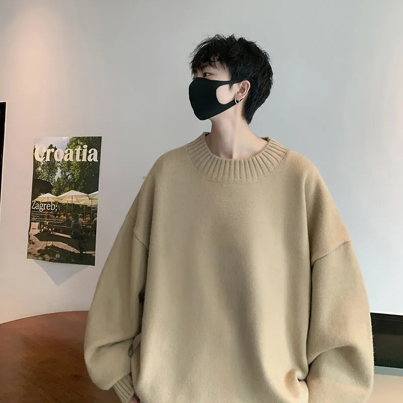 Men's loose-fitting round neck pullover sweater in solid colour with long sleeves