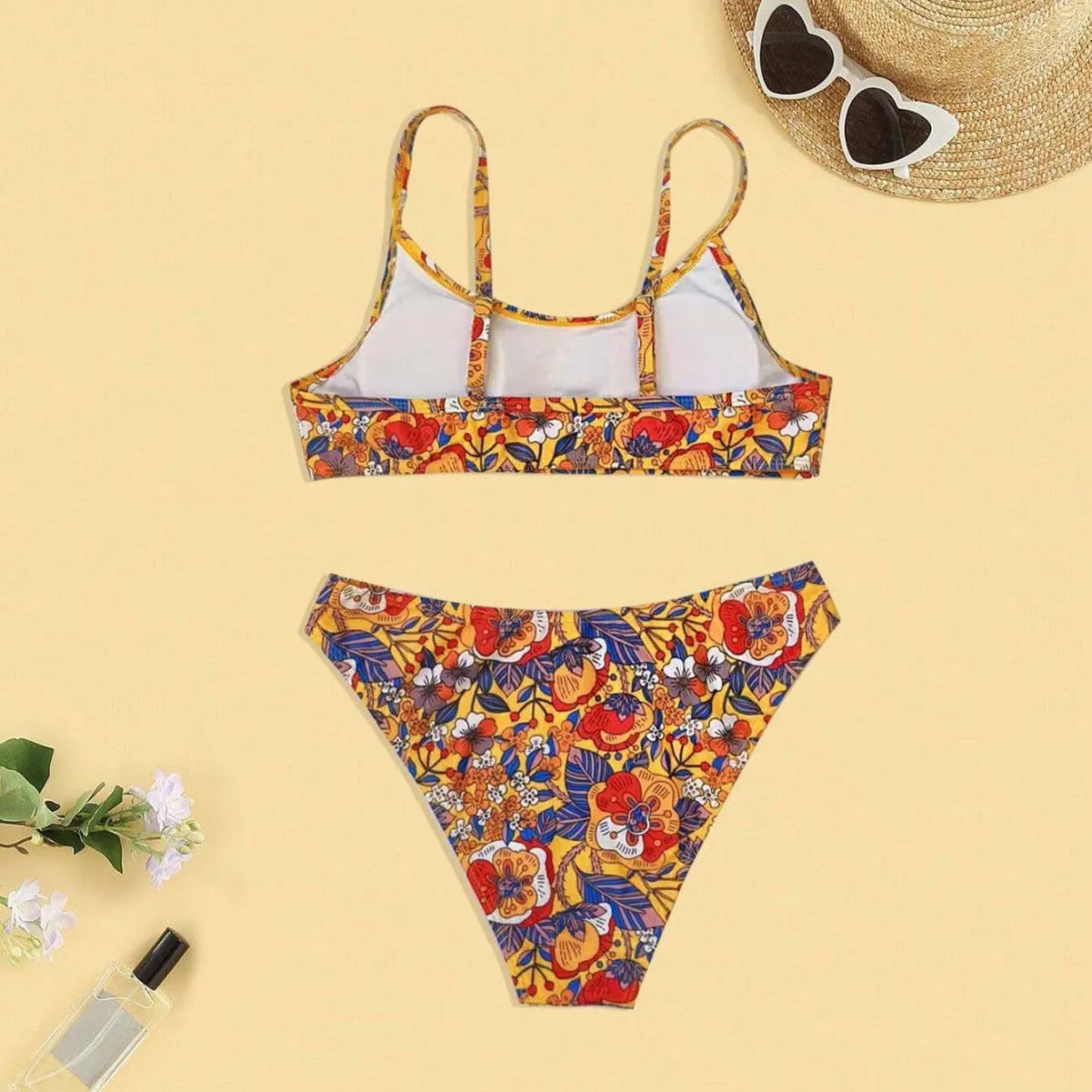 Plus size floral print women's bikini swimsuit with adjustable straps.