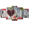Set of red unframed oil painting decoration boards in graduated sizes arranged on a wall.