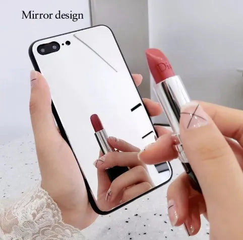 Black mirror back cover phone case for Apple iPhone X, 11, 12, 7, 8, and 6 models on a table.