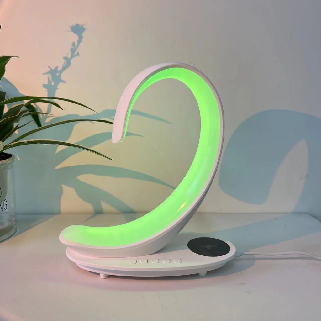 White swan-shaped desk lamp with colourful LEDs, integrated wireless charger, and Bluetooth speaker.