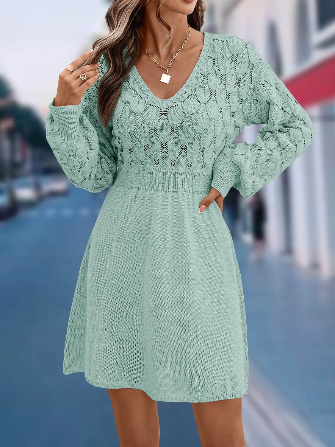 Women's artistic retro V-neck long sleeve dress in a light blue green colour with a 3D pattern detail.