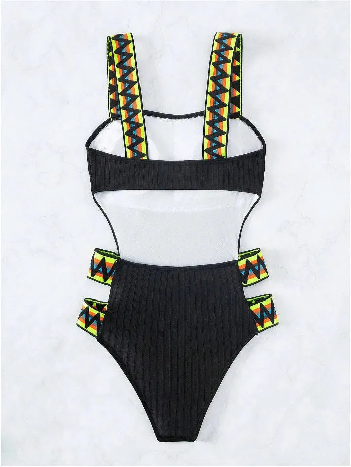 Solid colour women's one-piece swimsuit in black or orange, made from polyester fabric.