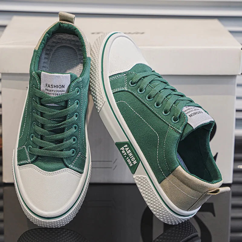 Men's blue low-top canvas skateboard shoes with round toe and white lace-up front.
