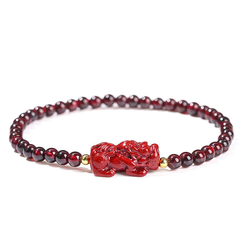 Geometric square garnet bracelet with carved purple pixiu charm on wrist