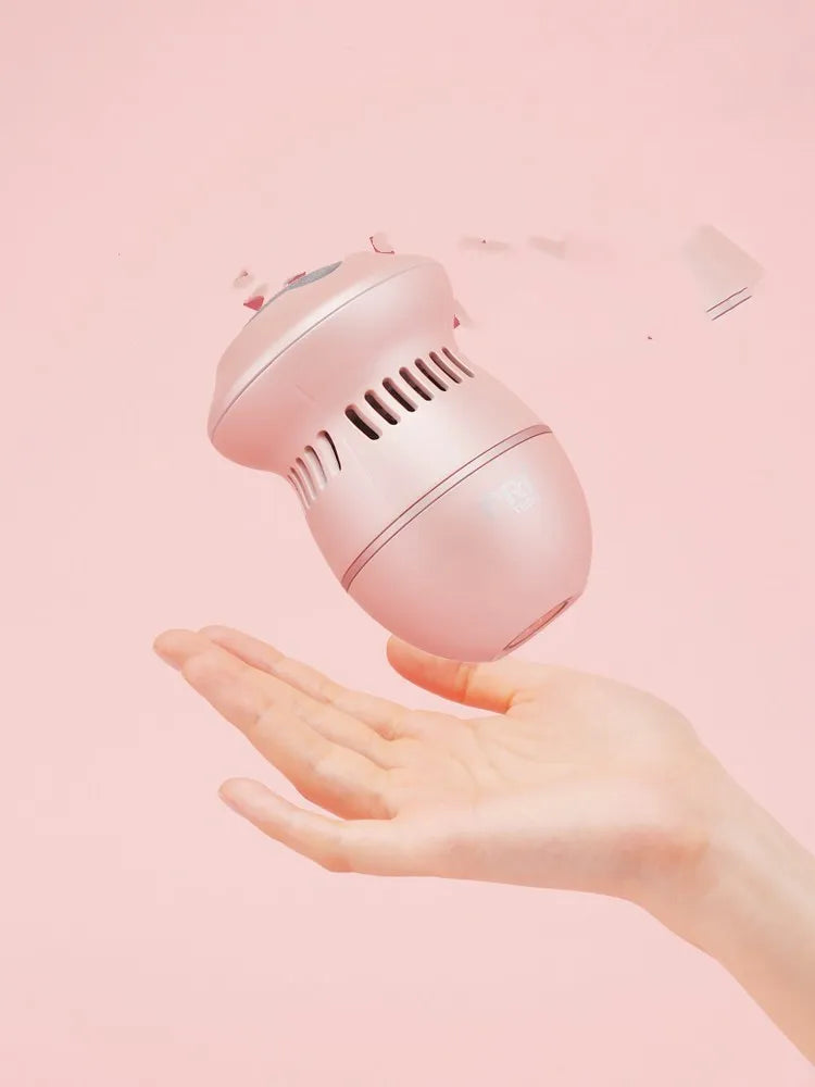 Beige electric foot file grinder with diamond grinding heads and USB charging cable