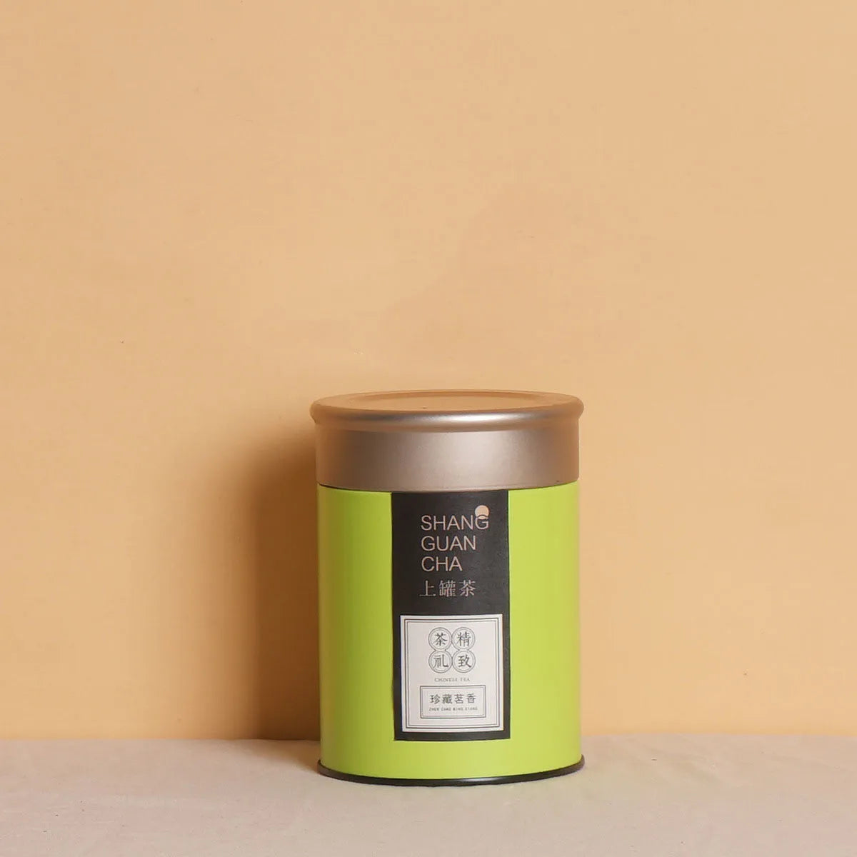 Green tinplate tea packing box with sealed lid, 150ml capacity for loose leaf tea storage.
